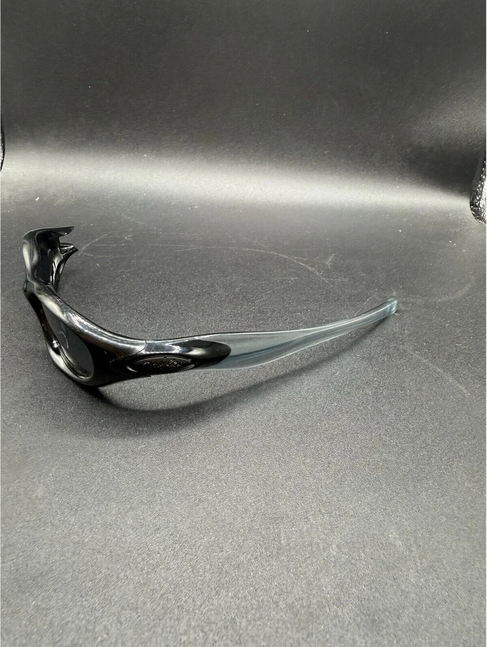 Oakley Pocket Polished Black/Black Iridium Lenses (Missing Right Arm)